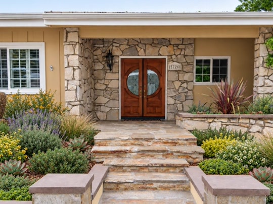 After the completed stone front entry landscape transformation