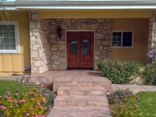 Before the stone front entry landscape transformation