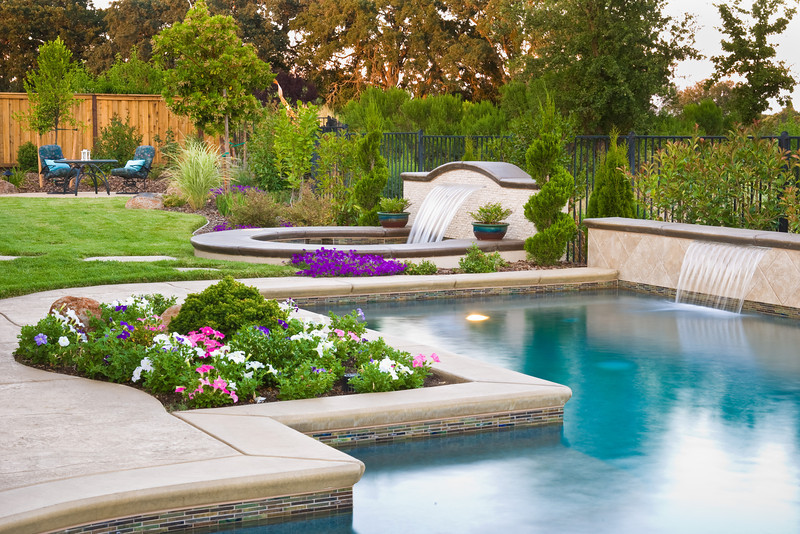 Luxury pool landscape with water features